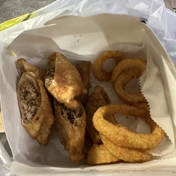 South Flavors - Jerk chicken egg rolls with onion rings. It looks small but, it's a very generous portion. - American Near Me - Philadelphia, Pennsylvania South Flavors - Jerk chicken egg rolls with onion rings. It looks small but, it's a very generous portion. - American Near Me - Philadelphia, Pennsylvania