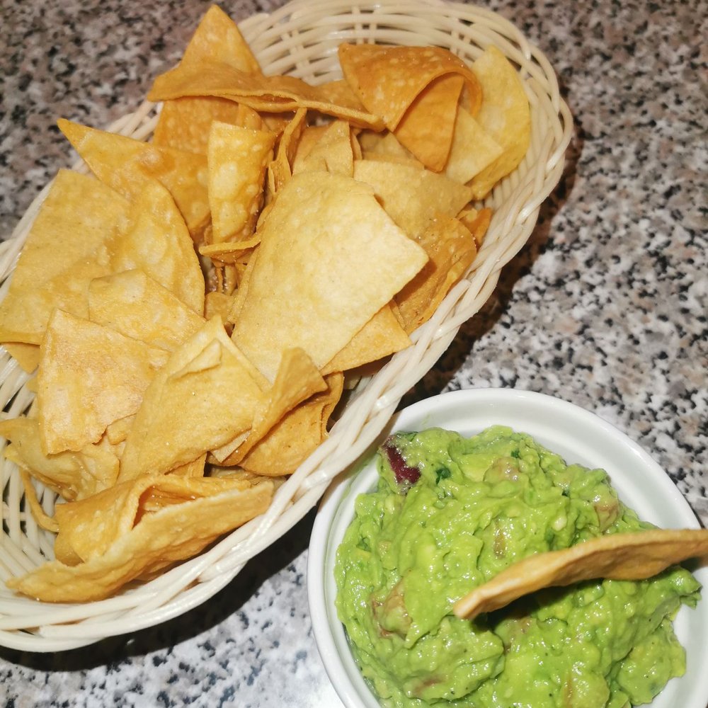 Tacochon - a bowl of chips and a bowl of guacamole - Mexican Near Me - Laval, Quebec