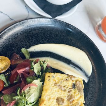 Iron Rose Bar & Restaurant - Wild mushroom quiche with salad and fresh fruits. - Breakfast & Brunch Near Me - Charleston, South Carolina Iron Rose Bar & Restaurant - Wild mushroom quiche with salad and fresh fruits. - Breakfast & Brunch Near Me - Charleston, South Carolina