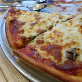 Pizza Papou Pita - a half eaten pizza - Pizza Near Me - Laval, Quebec Pizza Papou Pita - a half eaten pizza - Pizza Near Me - Laval, Quebec