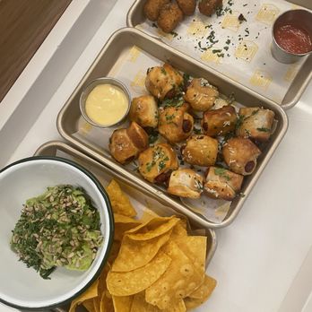 Lawn Club - Chips & Guacamole, pigs in the blanket and mozzarella bites. - Bars Near Me - New York, New York Lawn Club - Chips & Guacamole, pigs in the blanket and mozzarella bites. - Bars Near Me - New York, New York