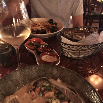 Mele Bistro - Squid Ink Ravioli & Seafood Fettucine and of course an empty bread basket - French Near Me - Arlington, Virginia Mele Bistro - Squid Ink Ravioli & Seafood Fettucine and of course an empty bread basket - French Near Me - Arlington, Virginia