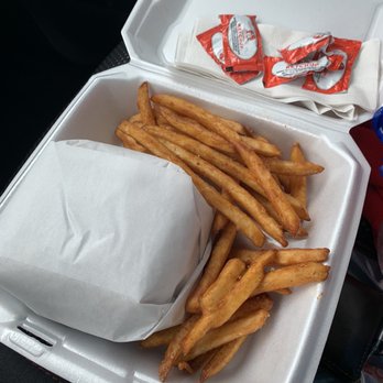 Fat Mo's - That may as well be wrapping paper, because the burger is a gift. That thing is amazing. Fries are good too - Burgers Near Me - Nashville, Tennessee