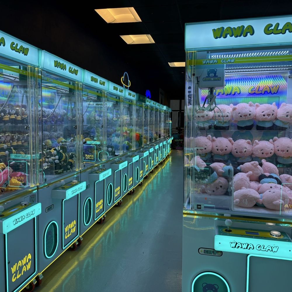 Rows of claw machines. Rows of claw machines.