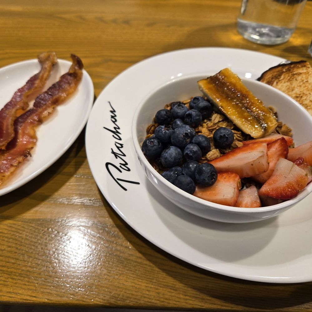 Cafe Patachou - Bruce's Granola Breakfast with a side of bacon and cinnamon toast. - Breakfast & Brunch Near Me - Indianapolis, Indiana Cafe Patachou - Bruce's Granola Breakfast with a side of bacon and cinnamon toast. - Breakfast & Brunch Near Me - Indianapolis, Indiana