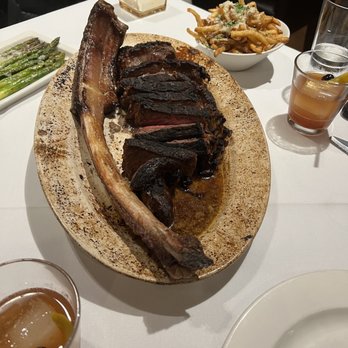 Rails Steakhouse - Tomahawk steak for two, asparagus, Parmesan truffle fries, barrel aged old fashioned - Steakhouses Near Me - Towaco, New Jersey