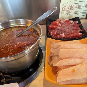Nine Spices Fondue - Chicken, beef brisket - hot pot slices. Cooks in 1 min. - Hot Pot Near Me - Gainesville, Florida Nine Spices Fondue - Chicken, beef brisket - hot pot slices. Cooks in 1 min. - Hot Pot Near Me - Gainesville, Florida