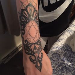 Chico's So. Broadway Tattoo Co. - He basically scribbled the inside even over the lines . Looks hideous .