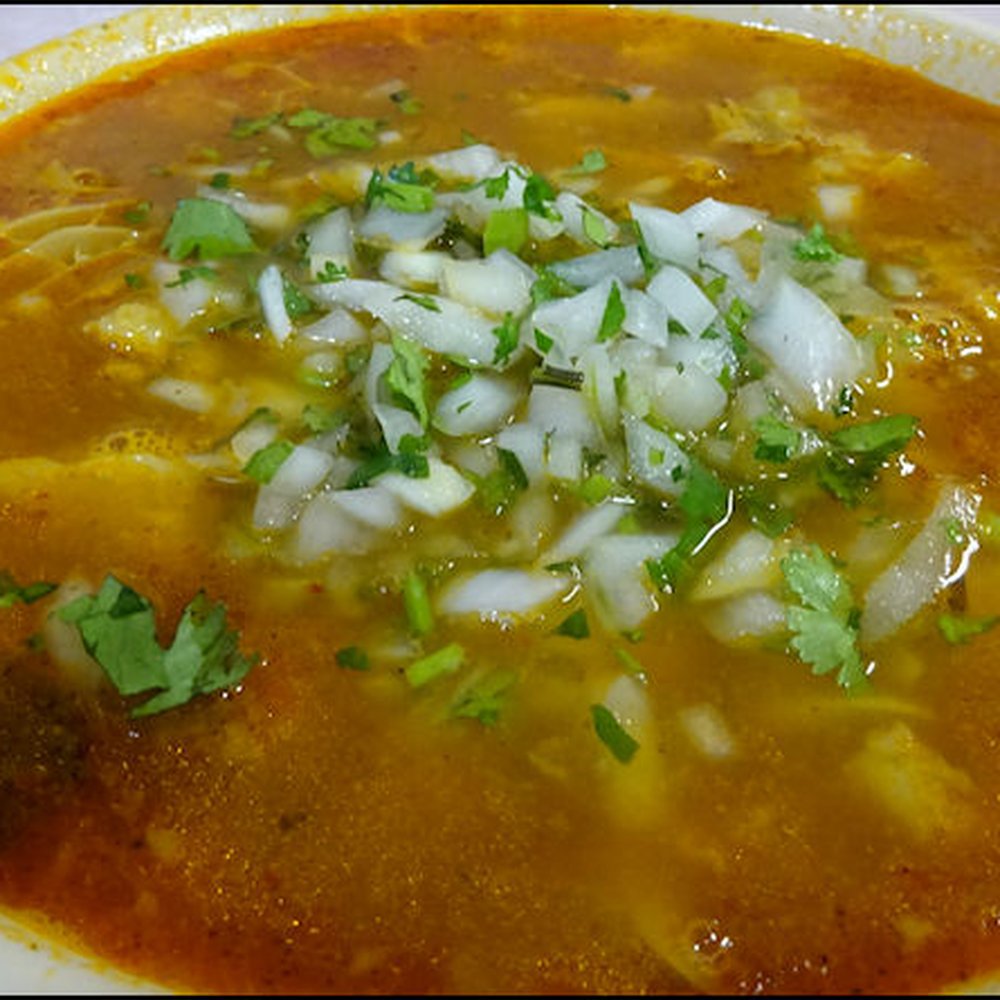 El Grullense - My bowl of menu after I added the diced onion and cilantro. Note the brick-red color, the wonderful tripe, and the sheen of the broth. - Mexican Near Me - Mojave, California El Grullense - My bowl of menu after I added the diced onion and cilantro. Note the brick-red color, the wonderful tripe, and the sheen of the broth. - Mexican Near Me - Mojave, California