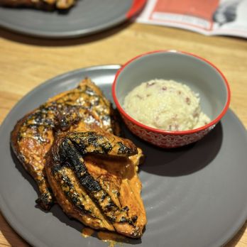 Nando's Peri-Peri - 1/2 Chicken with Red Skin Mashed Potatoes - Portuguese Near Me - Chicago, Illinois Nando's Peri-Peri - 1/2 Chicken with Red Skin Mashed Potatoes - Portuguese Near Me - Chicago, Illinois