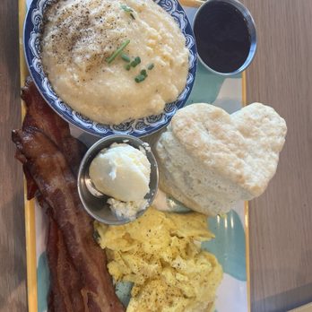 Biscuit Belly - The Belly Board with cheese grits, crispy bacon and hot biscuit and berry jam - Breakfast & Brunch Near Me - Fort Mill, South Carolina