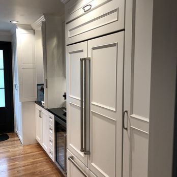 Paradigm Design Solutions - a kitchen with white cabinets and black countertops - General Contractors Near Me - Los Angeles, California Paradigm Design Solutions - a kitchen with white cabinets and black countertops - General Contractors Near Me - Los Angeles, California