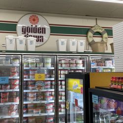 Zatsick's Golden Dawn - The original Golden Dawn logo above a well-stocked freezer section.