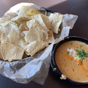 Torchy's Tacos - Green Chile Queso + Chips - Tex-Mex Near Me - Raleigh, North Carolina Torchy's Tacos - Green Chile Queso + Chips - Tex-Mex Near Me - Raleigh, North Carolina