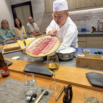 Sushi Suzuki - Chef Suzuki presenting diff cuts of tuna - Sushi Bars Near Me - Seattle, Washington