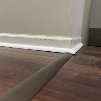 Refloor - a corner of a room with a wood floor - Flooring Near Me - Valley View, Ohio