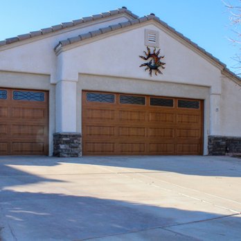 A Plus Garage Doors - Long panel garage doors with wood grain finish and decorative windows - Garage Door Services Near Me - Cedar City, Utah A Plus Garage Doors - Long panel garage doors with wood grain finish and decorative windows - Garage Door Services Near Me - Cedar City, Utah