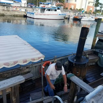 African Queen Key Largo - Captain readying the boat. - Boating Near Me - Key Largo, Florida African Queen Key Largo - Captain readying the boat. - Boating Near Me - Key Largo, Florida