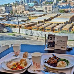 On the left is my salmon platter with a dessert bar, on the right is my friend's meatball platter, and way beyond is One World Trade Center On the left is my salmon platter with a dessert bar, on the right is my friend's meatball platter, and way beyond is One World Trade Center