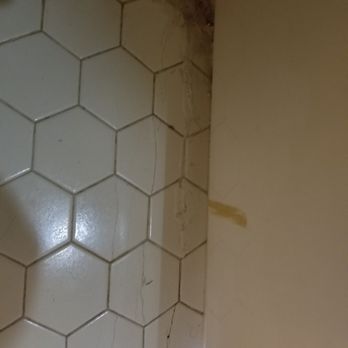 Seaside Vacations - Cracking tile and water damage in master bathroom - Vacation Rentals Near Me - Kitty Hawk, North Carolina Seaside Vacations - Cracking tile and water damage in master bathroom - Vacation Rentals Near Me - Kitty Hawk, North Carolina