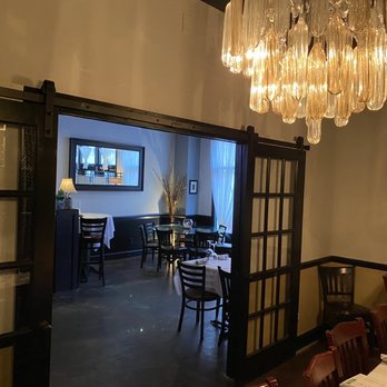 The Prescott - a dining room with a chandelier hanging from the ceiling - Diners Near Me - Kernersville, North Carolina The Prescott - a dining room with a chandelier hanging from the ceiling - Diners Near Me - Kernersville, North Carolina