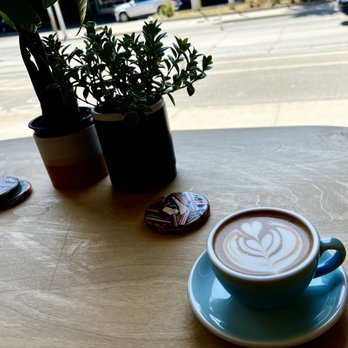 Bevy - a cup of coffee on a table - Coffee & Tea Near Me - Toronto, Ontario