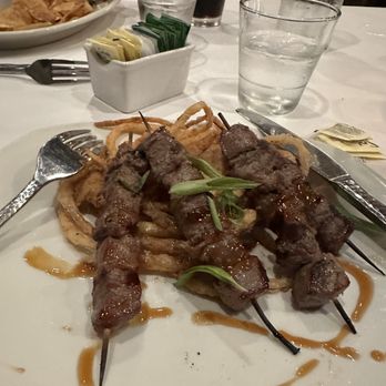 Weber Grill Restaurant - Steak skewers over frizzled onions. Incredibly tender! - Barbeque Near Me - Chicago, Illinois Weber Grill Restaurant - Steak skewers over frizzled onions. Incredibly tender! - Barbeque Near Me - Chicago, Illinois