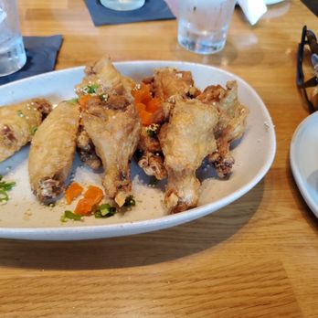 Mahi’ai Table - Appetizer, habanero chicken wings with the sauce on the side.  Meh - Cocktail Bars Near Me - Kapolei, Hawaii