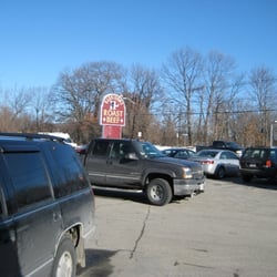 Harrison's Roast Beef - View of parking lot and the business sign.