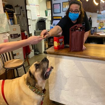 Uncorked Wine Shop - Local legend "Butter" the Mastiff is waiting for her treat from Barb and Paddy. - Beer, Wine & Spirits Near Me - Manhattan Beach, California