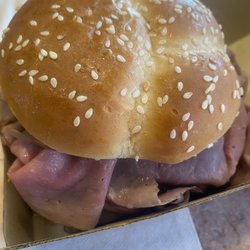 Arby's - A 1/2 lb roast beef sandwich as it was served to me. Plump bun, no finger marks and full.