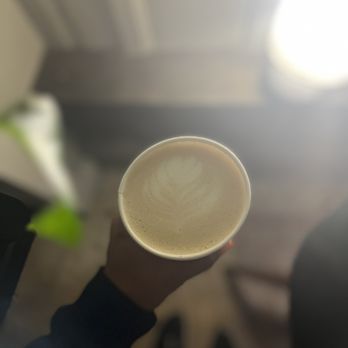 Old Road Coffee - a person holding a cup of coffee - Coffee & Tea Near Me - New Orleans, Louisiana Old Road Coffee - a person holding a cup of coffee - Coffee & Tea Near Me - New Orleans, Louisiana