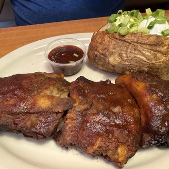 Texas Corral - Stevensville - Half slab ribs with loaded baked potato - American Near Me - Stevensville, Michigan