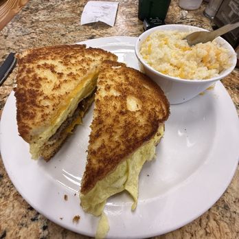 Florida Cracker Feed Lot - Sausage egg and cheese breakfast sandwich w cheese grits. - Breakfast & Brunch Near Me - Webster, Florida Florida Cracker Feed Lot - Sausage egg and cheese breakfast sandwich w cheese grits. - Breakfast & Brunch Near Me - Webster, Florida