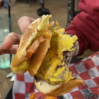 XIT Woodfire Grill - The classic burger, spread wide to show off the layers of taste. It was fine. - Steakhouses Near Me - Dalhart, Texas XIT Woodfire Grill - The classic burger, spread wide to show off the layers of taste. It was fine. - Steakhouses Near Me - Dalhart, Texas