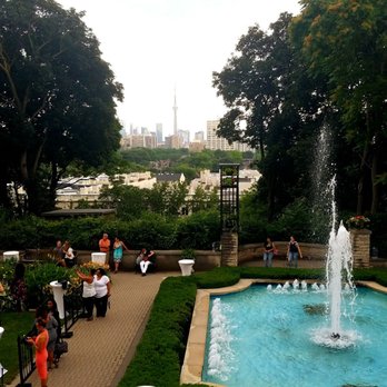 Casa Loma - Nicely placed view of the CN Tower from the gardens - Museums Near Me - Toronto, Ontario Casa Loma - Nicely placed view of the CN Tower from the gardens - Museums Near Me - Toronto, Ontario