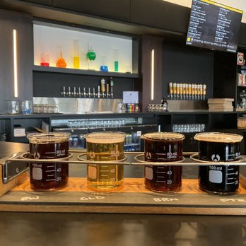 Delta Beer Lab - Tap room flight.  Cool beakers and theme. - Breweries Near Me - Madison, Wisconsin