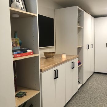 ProKitchen and Surfaces - Media center inspired cabinetry. Deep storage solutions with modern living space access - Kitchen & Bath Near Me - Anaheim, California