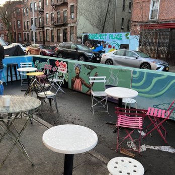 Aura Coffee  - ables and chairs on a city street - Coffee & Tea Near Me - Brooklyn, New York