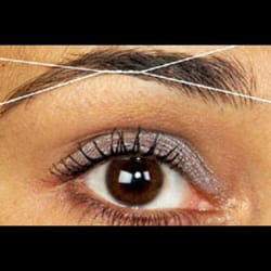 Saylah Threading & Day Spa - Technic of shaping brows with thread.