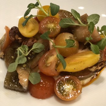 Marky's Caviar Lounge - Tomato salad with homemade stracciatella cheese and homemade candies pecans with their special garlic chili dressing !   To die for - Seafood Near Me - Hollywood, Florida