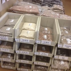 Hutto's Home and Garden Center - Smile bags of different kinds of fertilizer