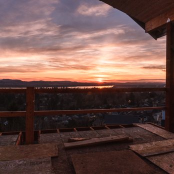 RHC Construction - a view of a sunset from a deck - General Contractors Near Me RHC Construction - a view of a sunset from a deck - General Contractors Near Me