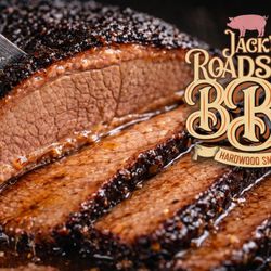 Jack’s Roadside BBQ Smokehouse - Slow-smoked brisket with a bold smoky bark and tender, juicy center. Sliced fresh and packed with flavor.