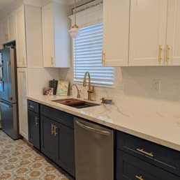 a kitchen with white cabinets and blue cabinets a kitchen with white cabinets and blue cabinets