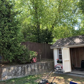 Capital Fence & Construction - a lawn mower in front of a shed - Fences & Gates Near Me - Bronxville, New York Capital Fence & Construction - a lawn mower in front of a shed - Fences & Gates Near Me - Bronxville, New York