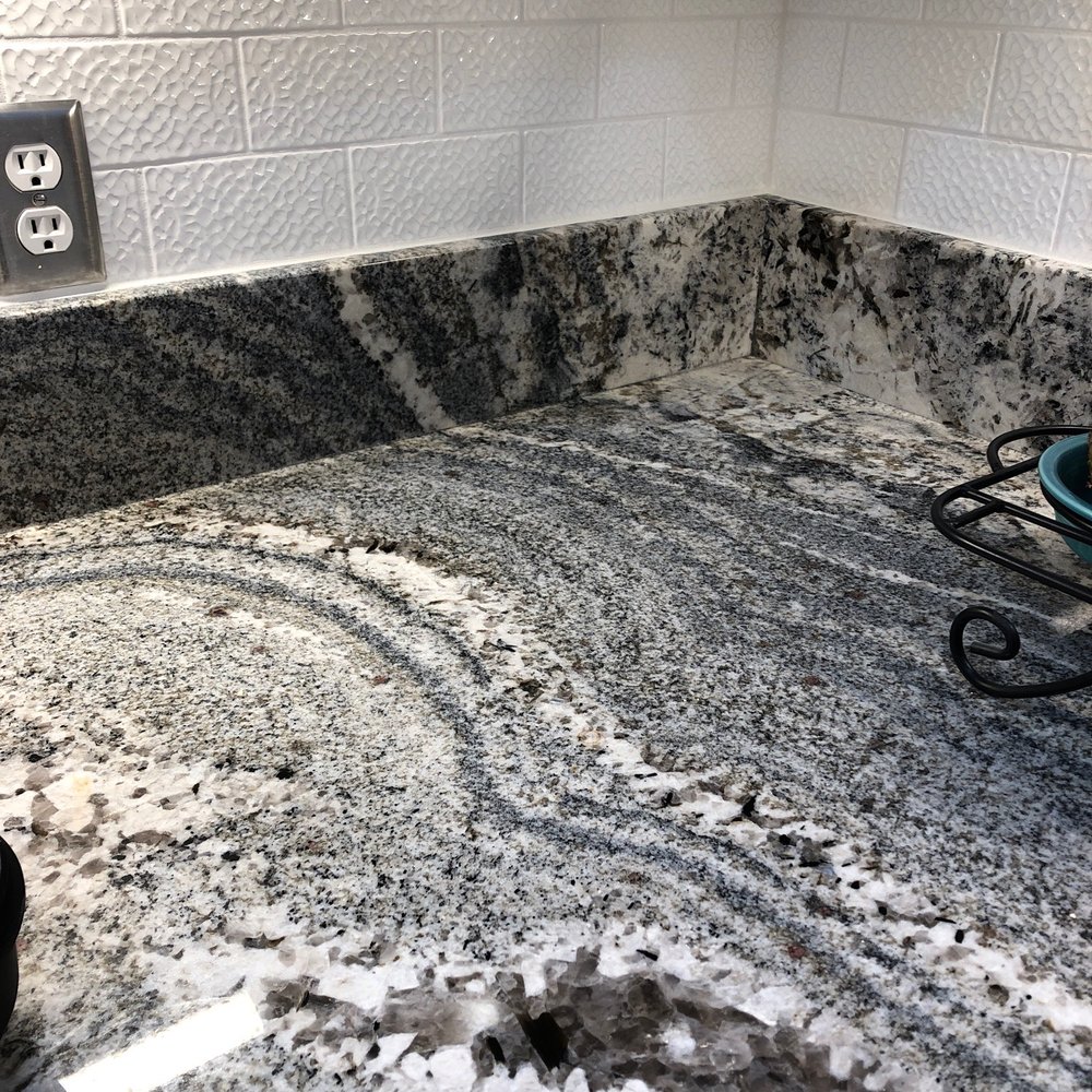 Lucinay Granite - Great example of workmanship showing how granite flows into back splash. - General Contractors Near Me - Bertram, Texas Lucinay Granite - Great example of workmanship showing how granite flows into back splash. - General Contractors Near Me - Bertram, Texas