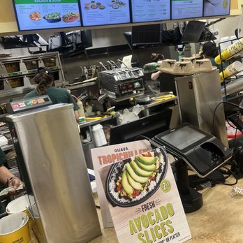 Pollo Tropical - a restaurant counter with menus - Latin American Near Me - Miami, Florida Pollo Tropical - a restaurant counter with menus - Latin American Near Me - Miami, Florida
