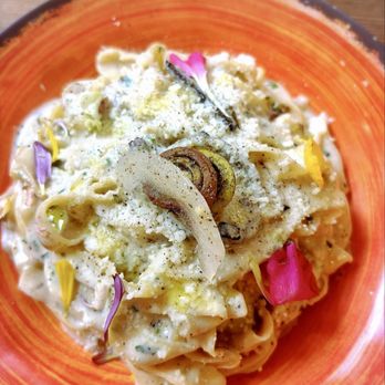 Pasta Casalinga - fettuccine with edible flowers, foraged fiddleheads, herb ricotta, and pickled serrano - Italian Near Me - Seattle, Washington Pasta Casalinga - fettuccine with edible flowers, foraged fiddleheads, herb ricotta, and pickled serrano - Italian Near Me - Seattle, Washington