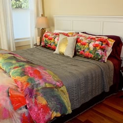 The Baci Suite boasts a king bed, antique gentlemen's wardrobe armoire and a large private bath, plus corner sun room.